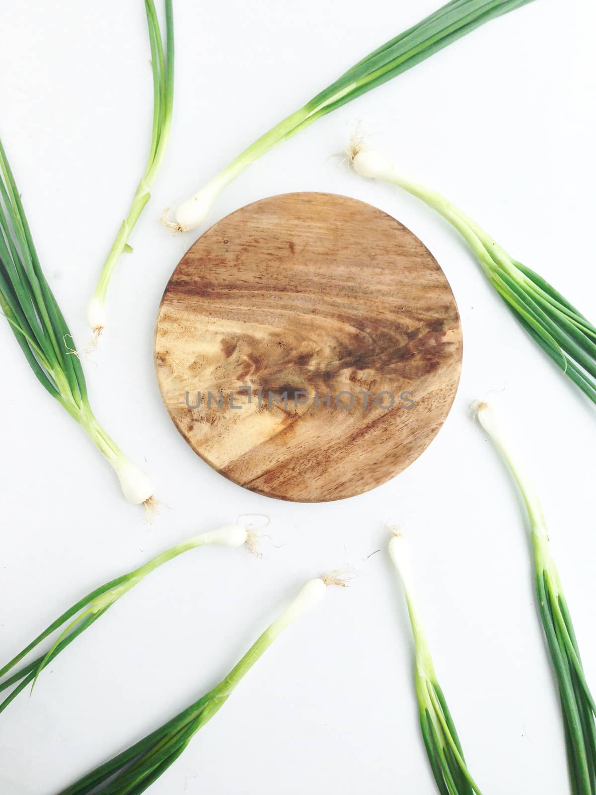 spring onion and cutting board by Bowonpat