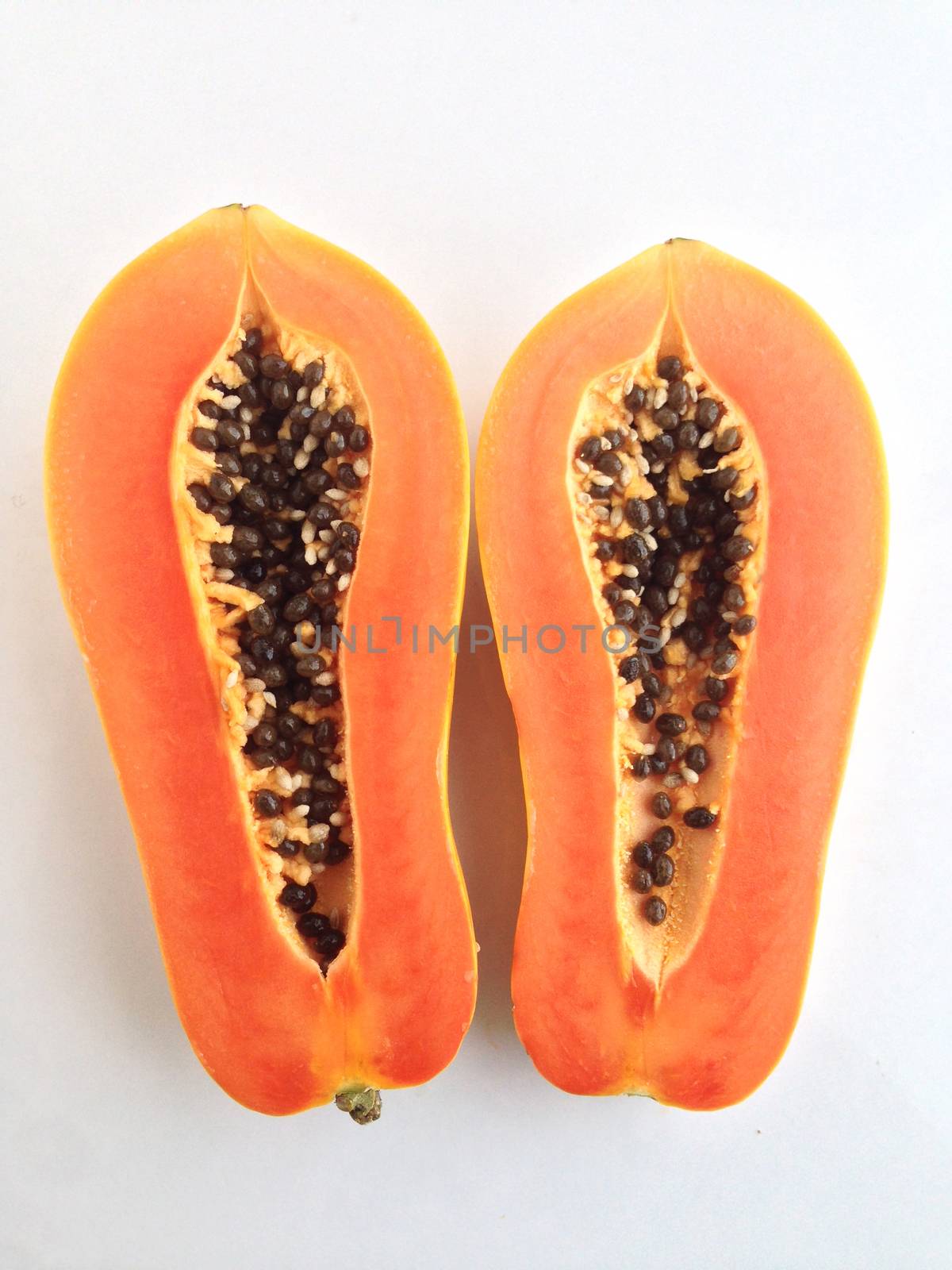 slices of sweet papaya on white background by Bowonpat