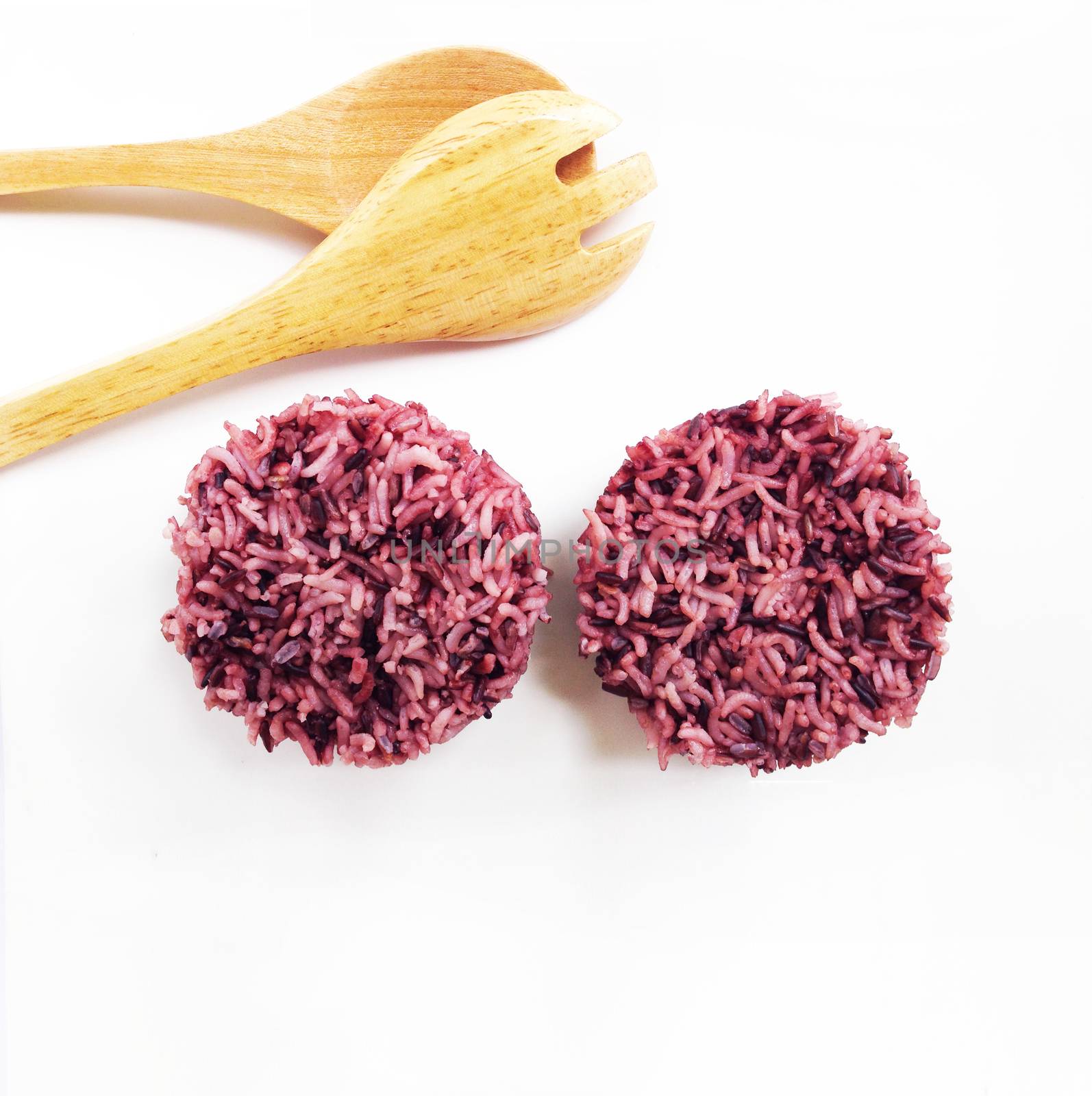 Thai white rice and rice berry mixed with spoon and fork on white background