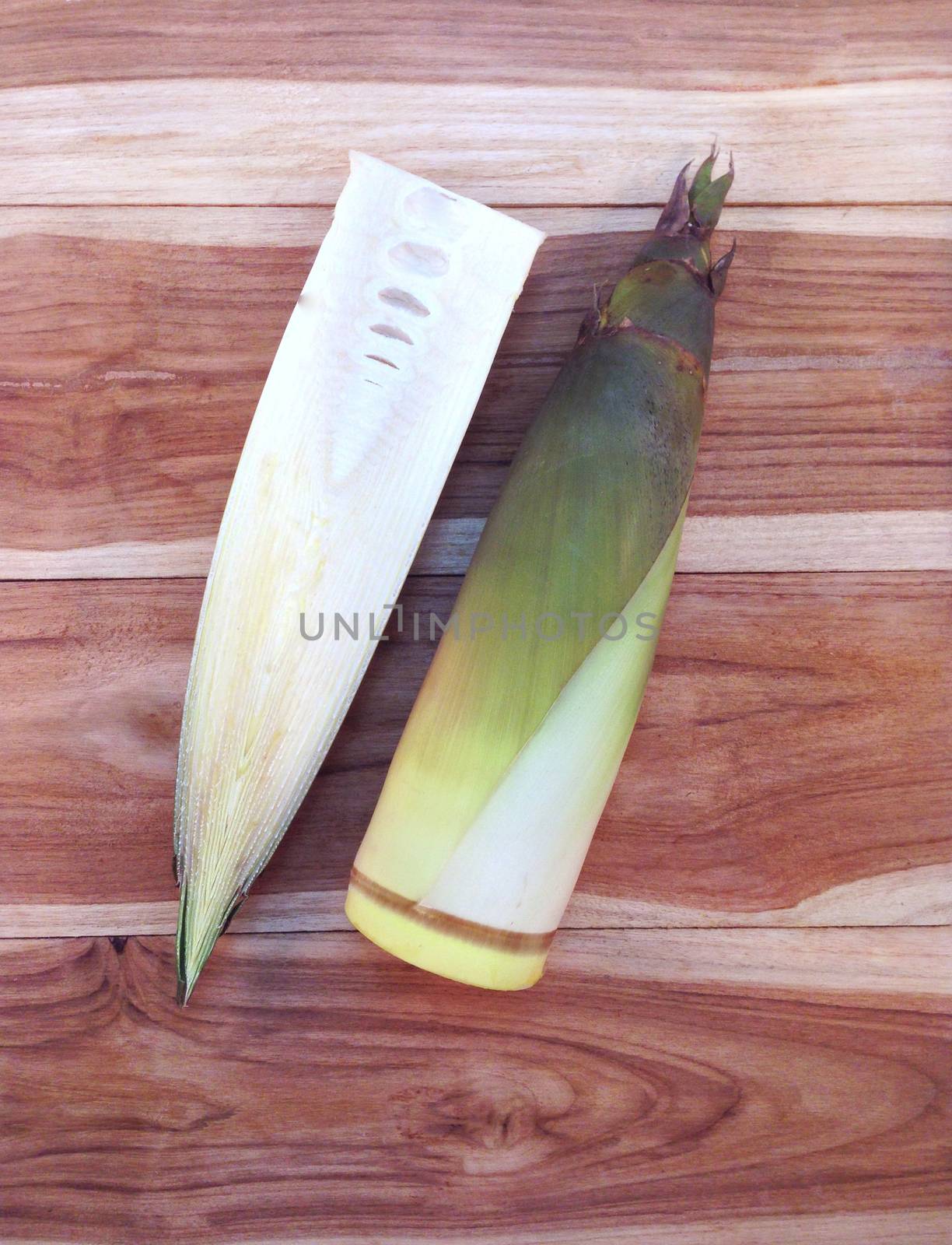 Bamboo shoots  on wooden background  by Bowonpat