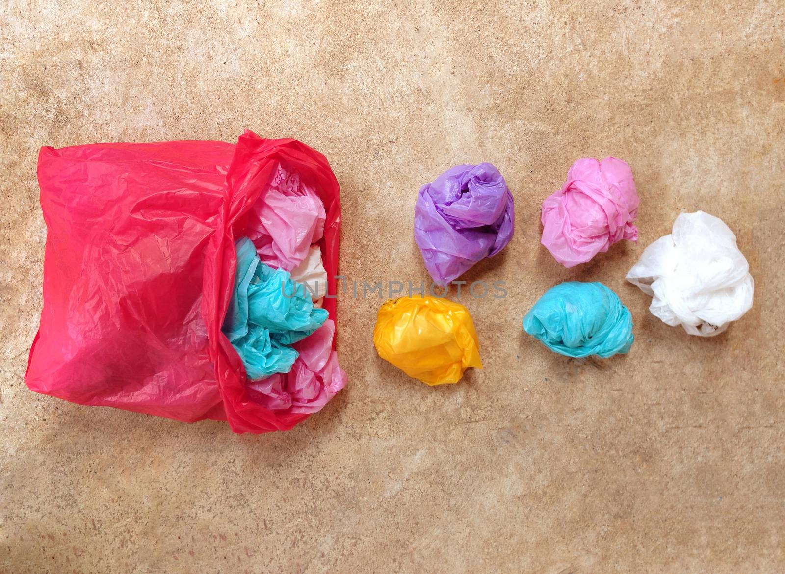 Colorful plastic bag on cement floor