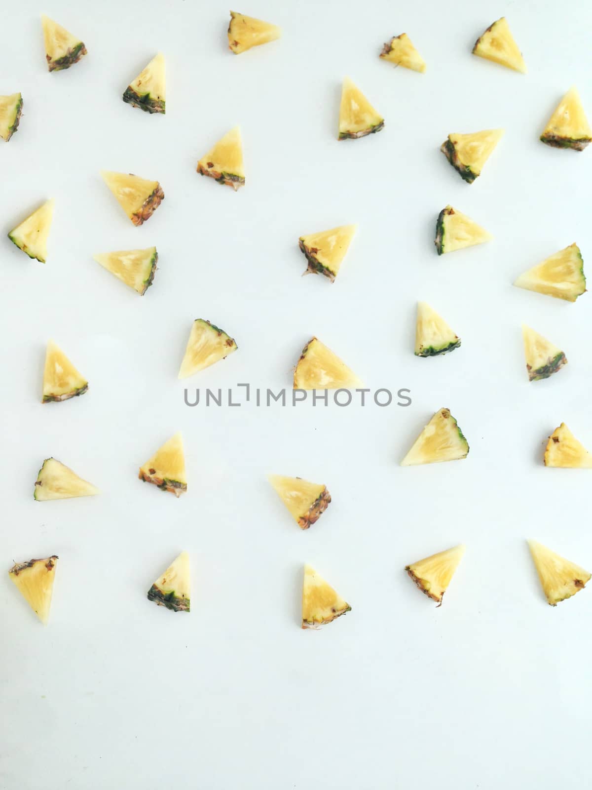 Fresh  triangular piece of pineapple by Bowonpat