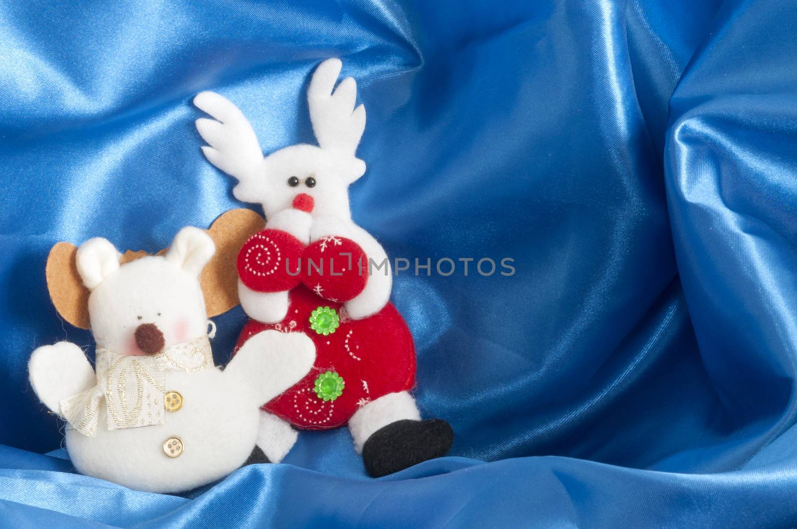 small plush animals on  a blue background