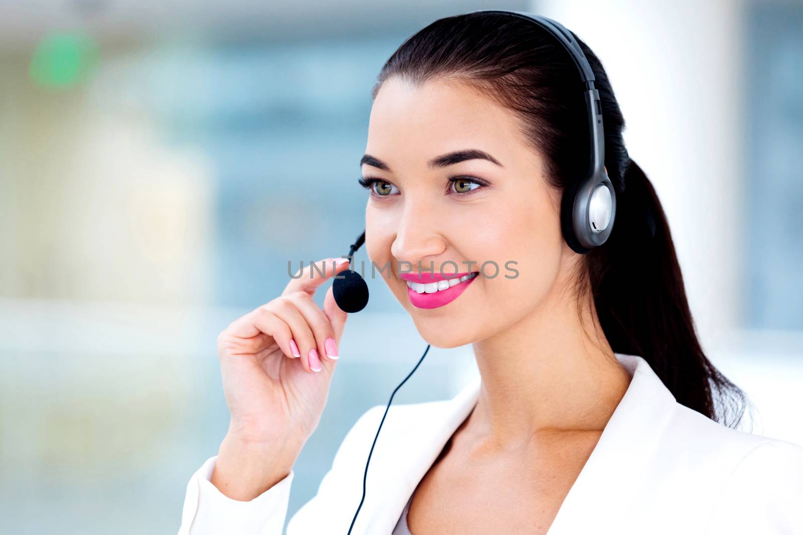 Closeup portrait of support phone operator in headset at workpla by Nobilior