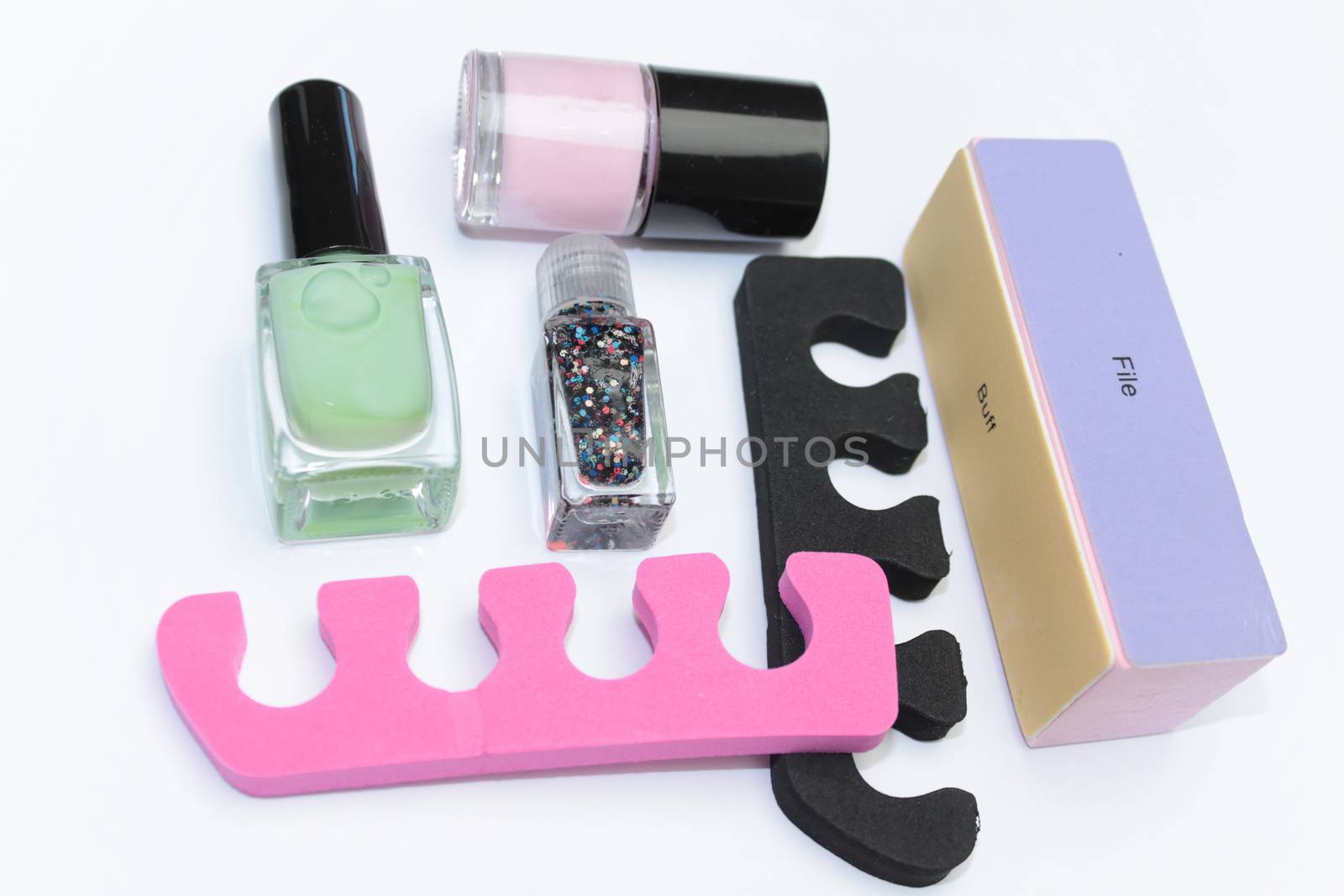 Manicure set with white tip polish, dividers and top coat shine applicator for nails on white background by Kasia_Lawrynowicz