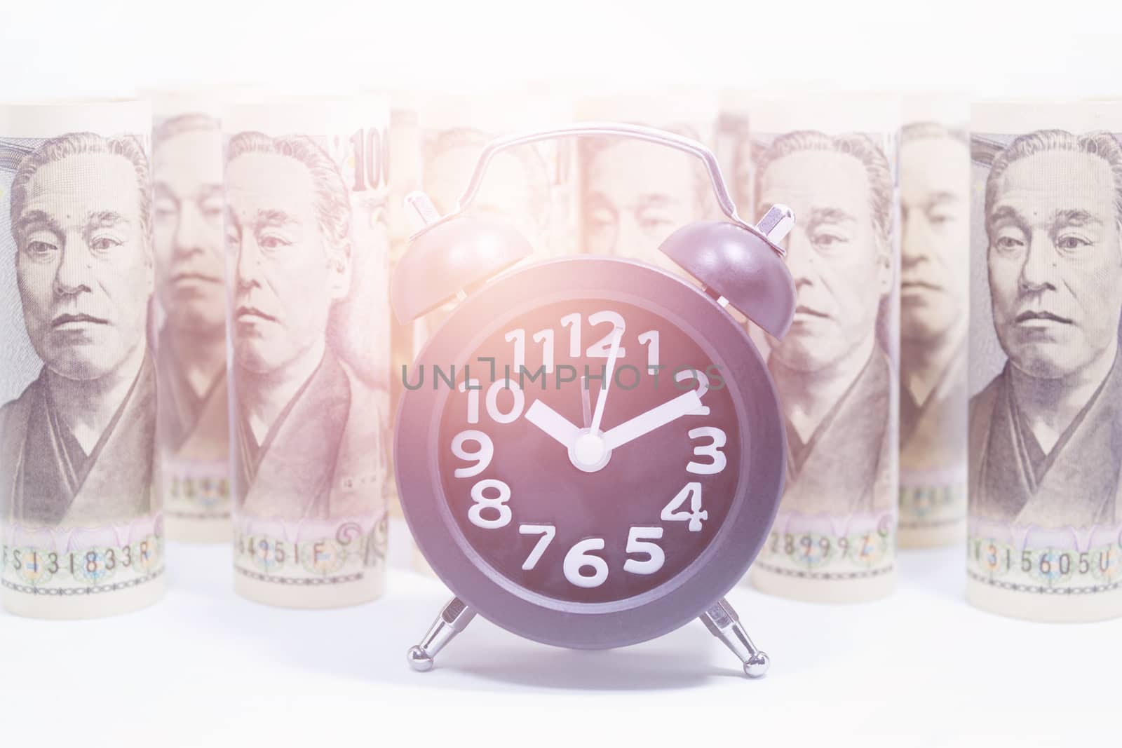 Classic Clock On Roll Of Yen Banknote, Concept And Idea Of Time  by rakoptonLPN