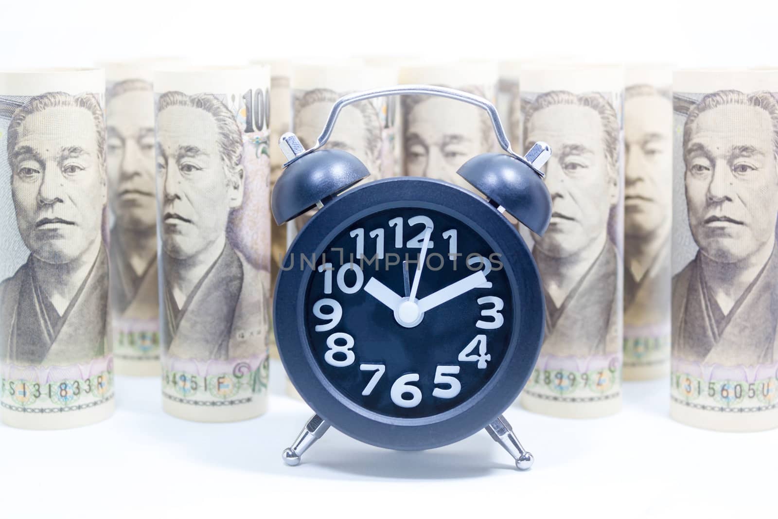 Classic Clock On Roll Of Yen Banknote, Concept And Idea Of Time  by rakoptonLPN