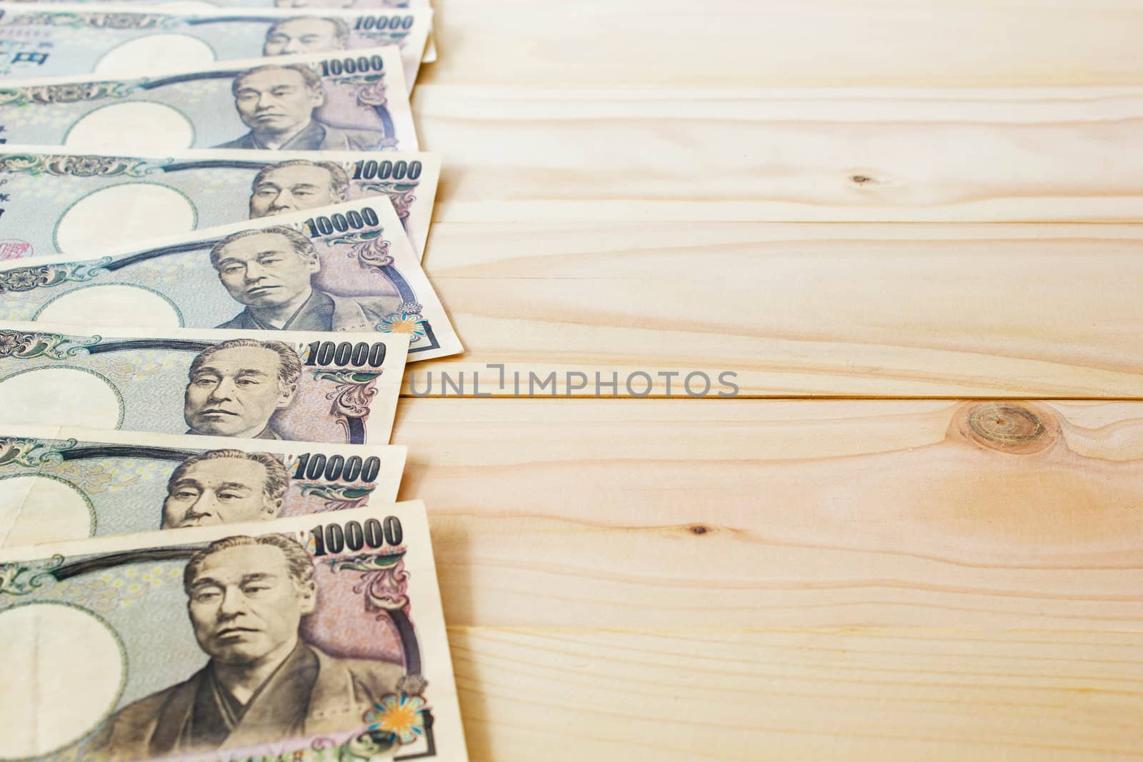 Money Yen Banknote On Vintage Wooden Background, Business And Fi by rakoptonLPN