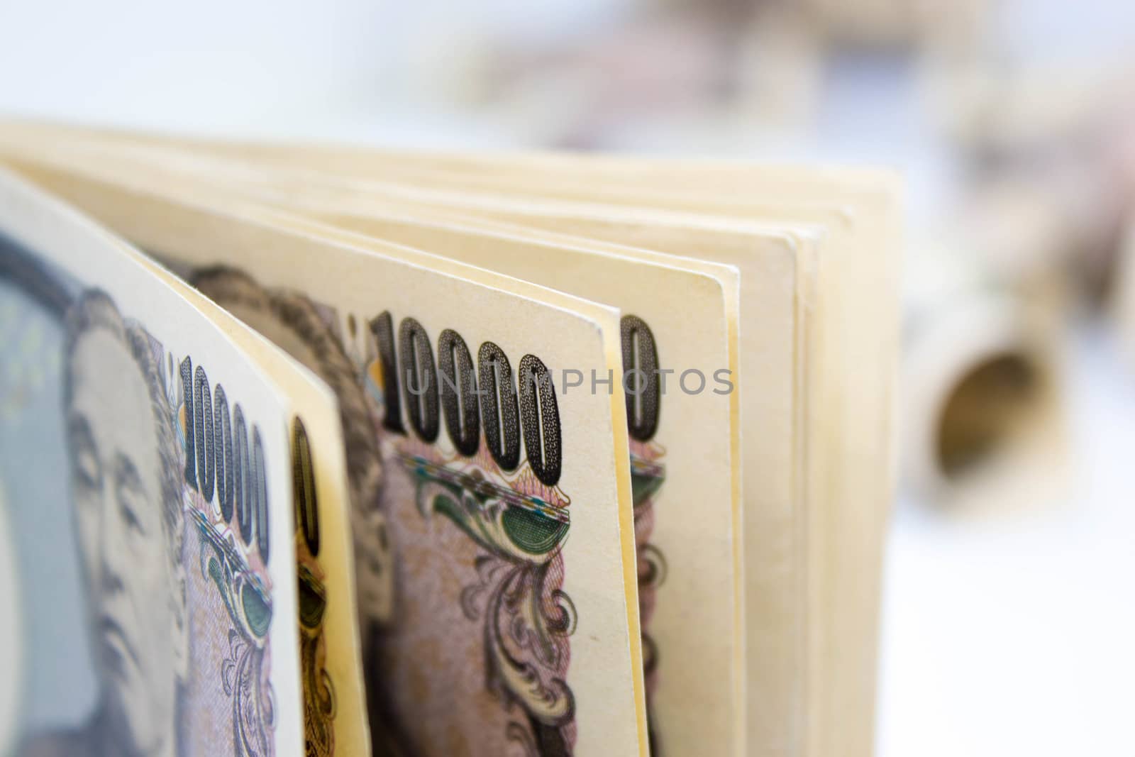 Money Ten Thousand Yen Banknote On White Background, Business An by rakoptonLPN