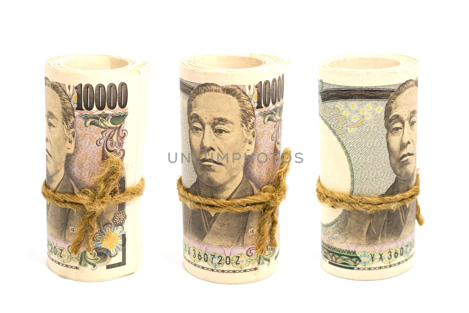 Three Roll Up Of Money Yen Banknote On White Background, Busines by rakoptonLPN