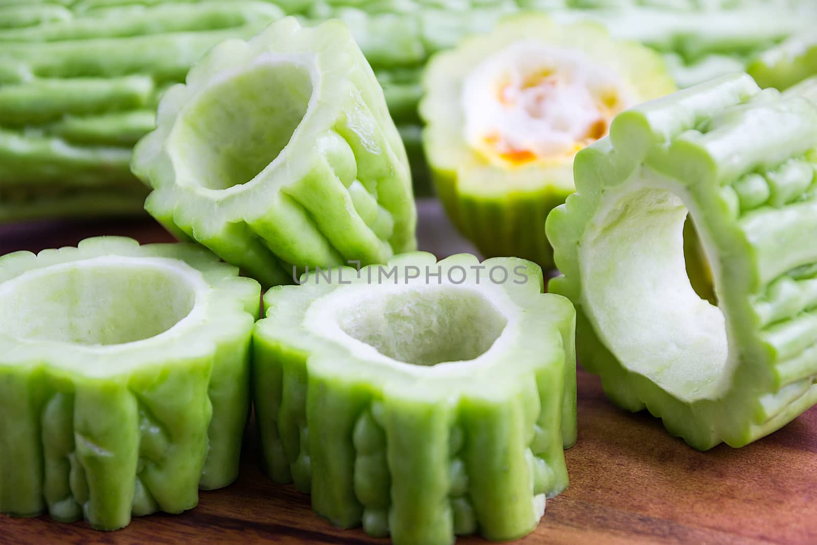 Fresh Green Bitter Cucumber Or Chinese Bitter Melon Or Melon Sliced In Pieces 
