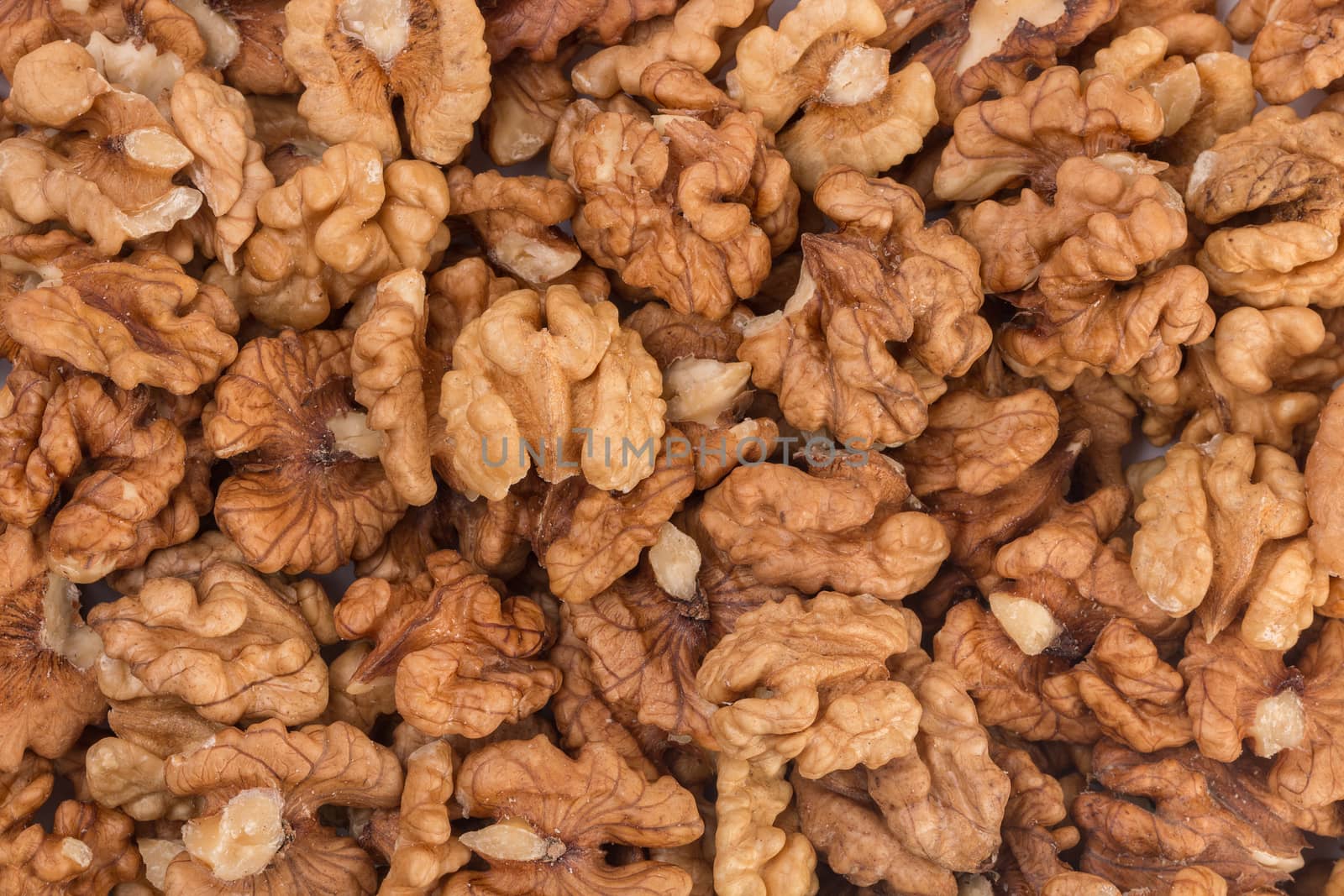 Closeup of big shelled walnuts pile, texture