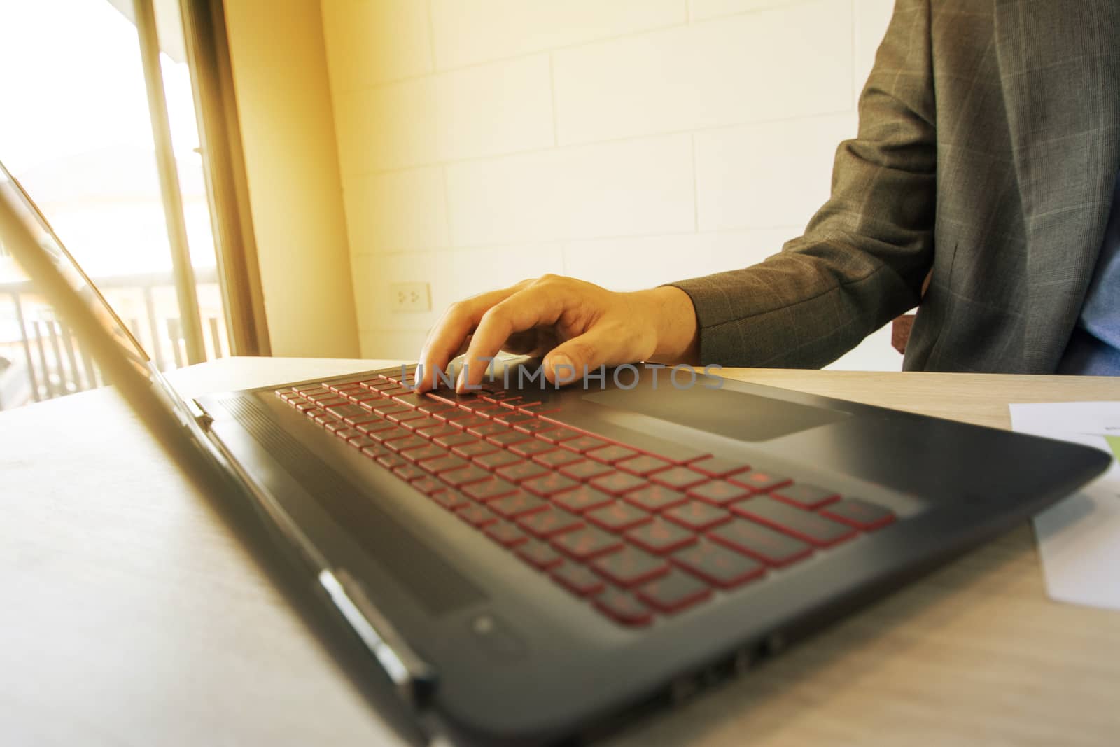 Business man working  with laptop and documents on wood table
