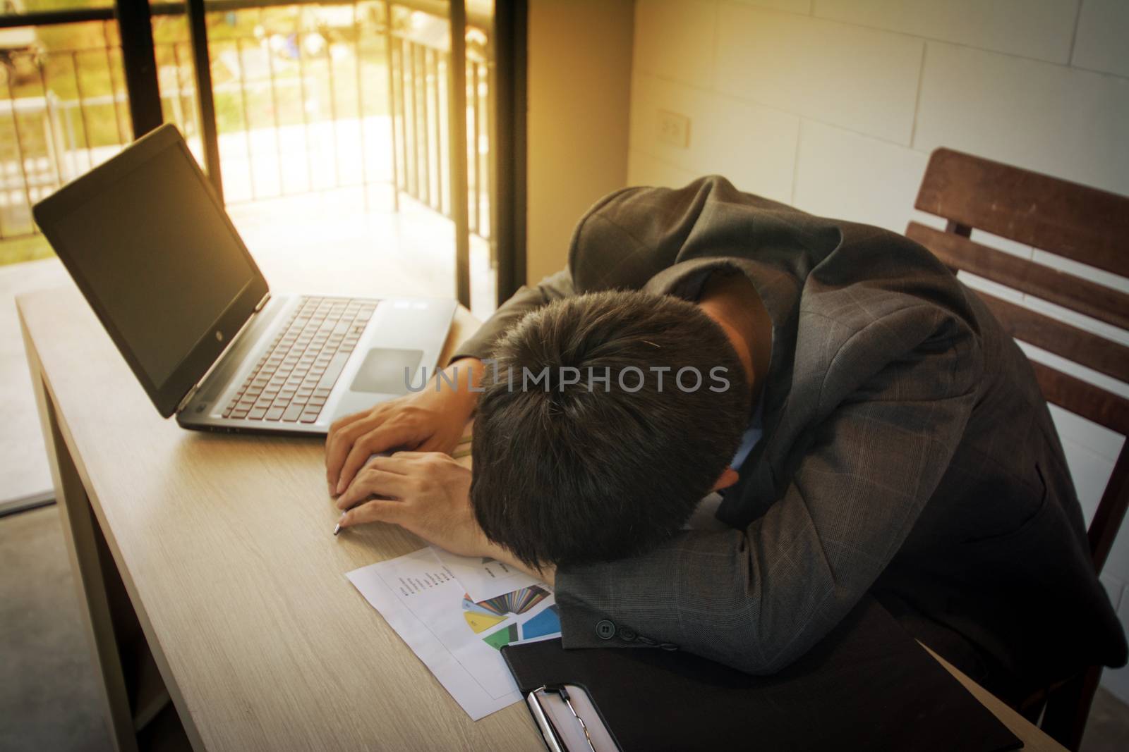 stressed business man on wood table