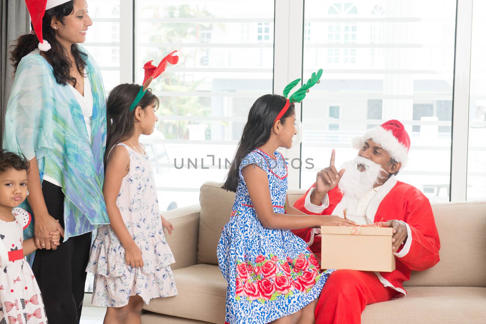 Indian family celebrating Christmas day by szefei