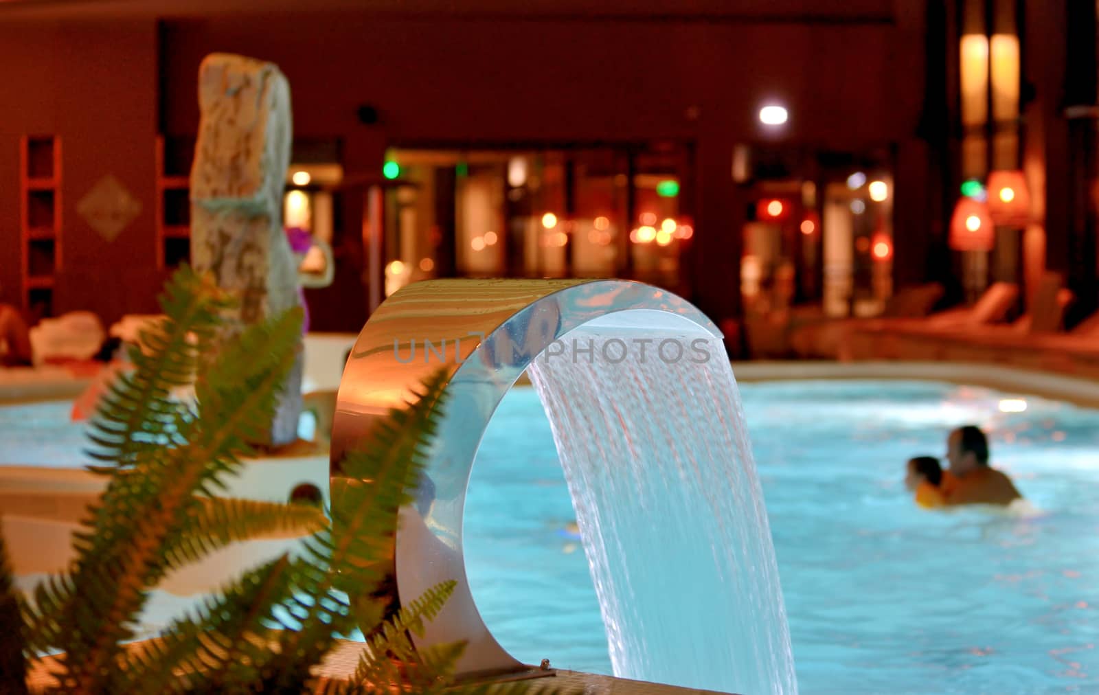 Relaxation pool in spa with waterfall