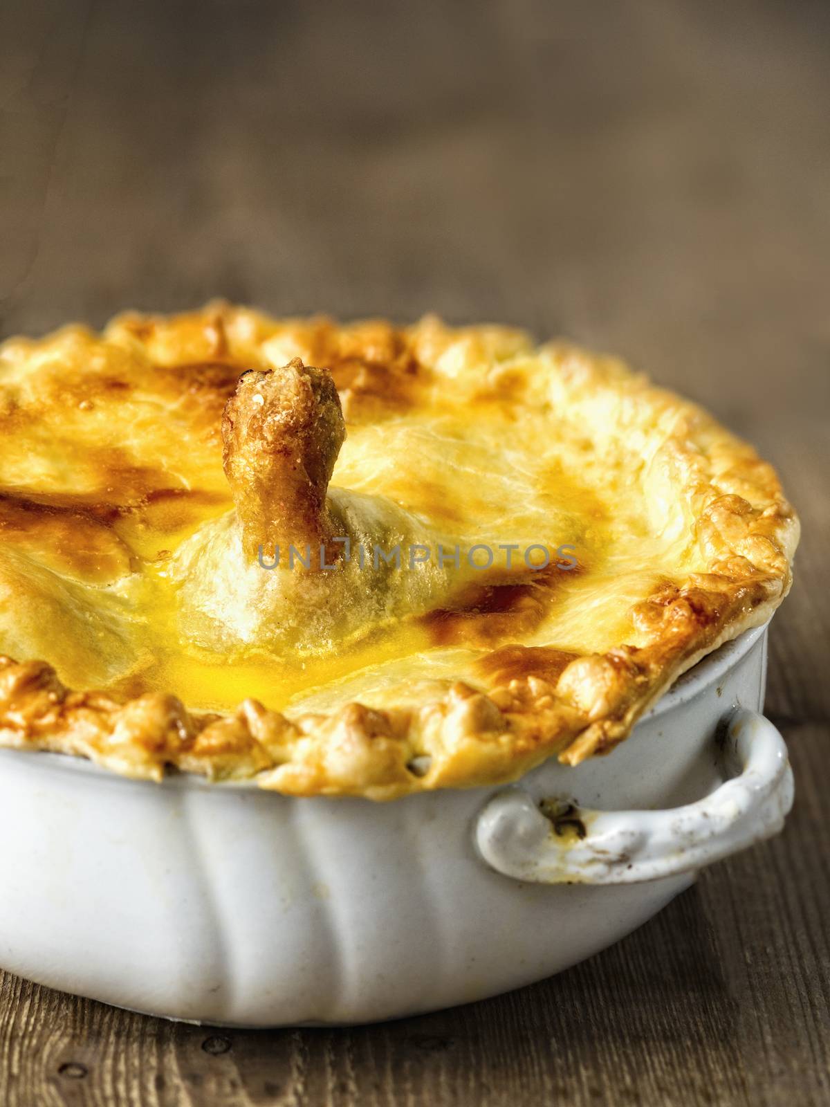 close up of golden rustic english chicken pie