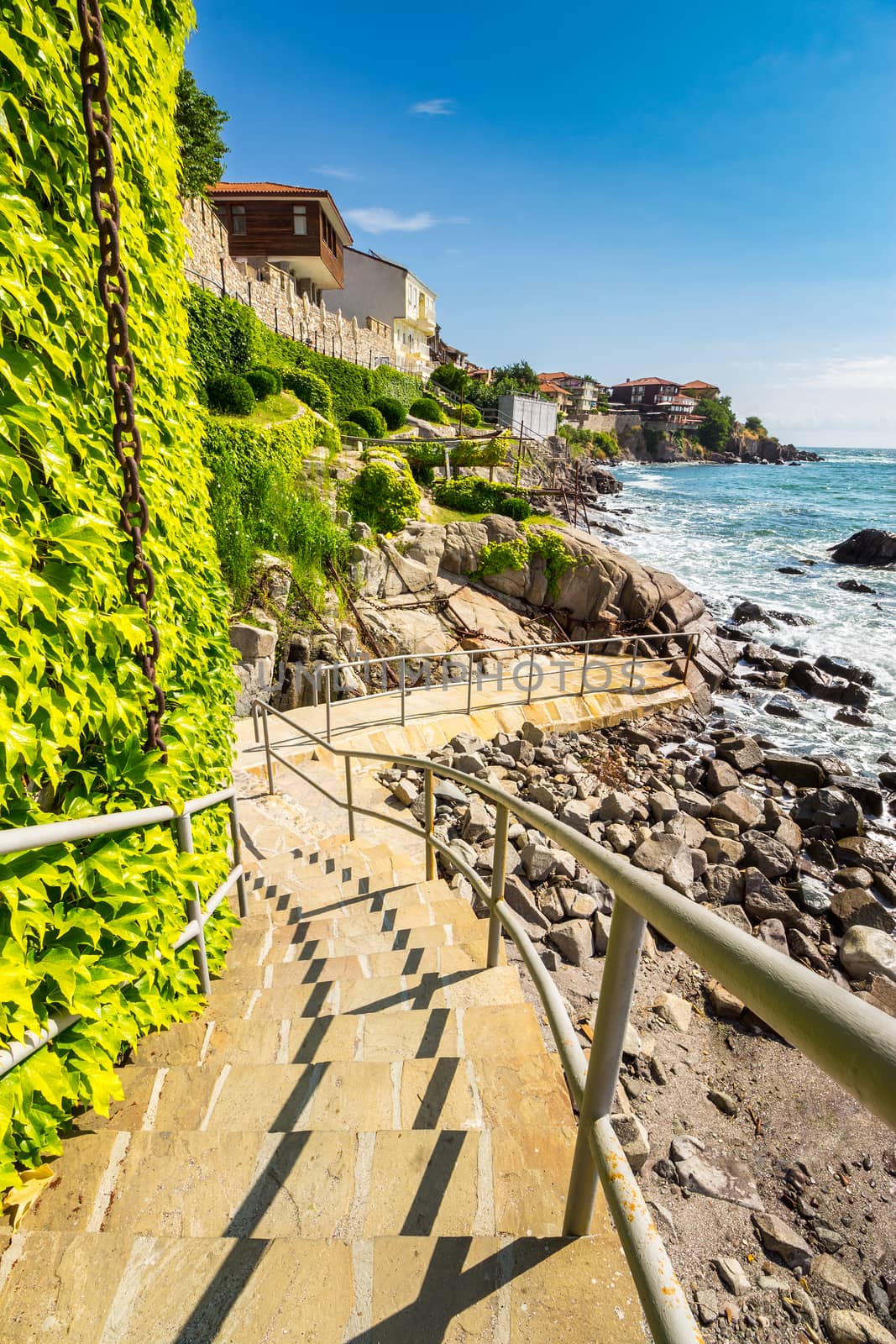 steps to the rocky shore from the old town by Pellinni