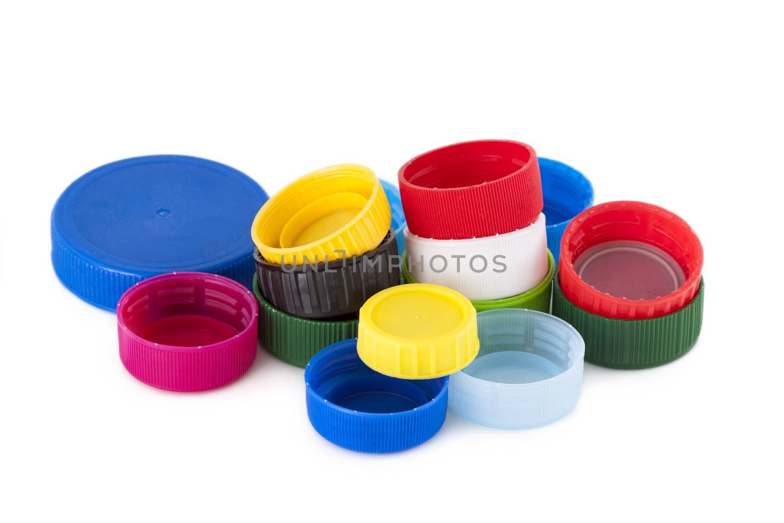 Few colored plastic bottle cap isolated on white background