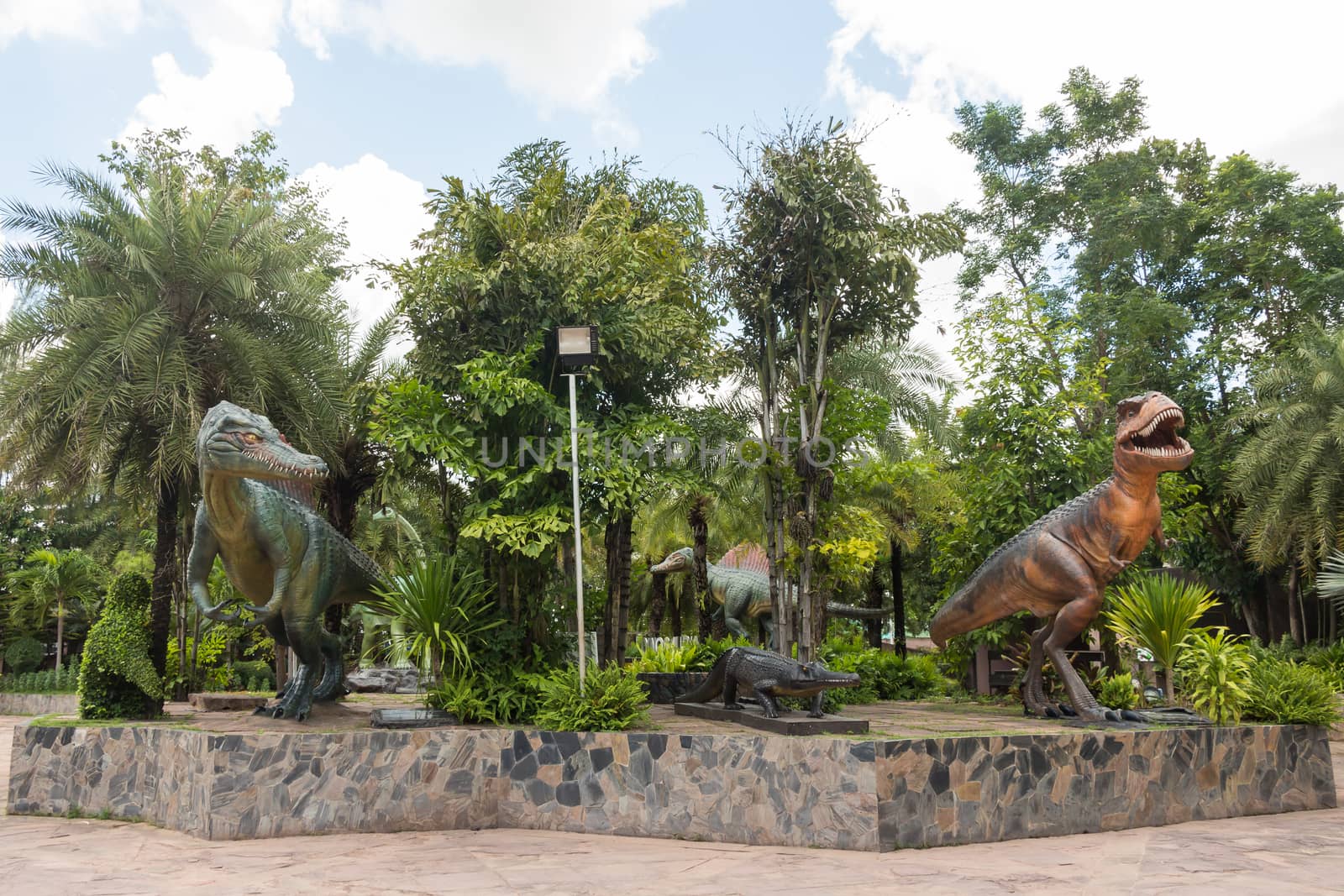 Statue of dinosaurs at outdoor part of Sirindhorn Museum , Kalasin , Thailand .