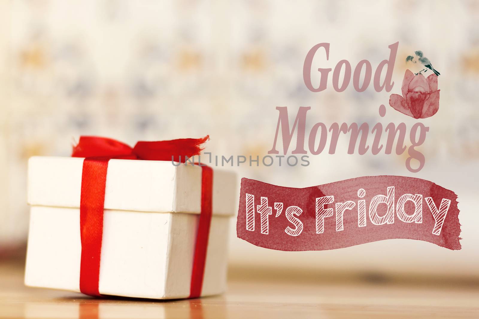 good morning it's friday message with white gift box with red ribbon on wood background by sigoisette