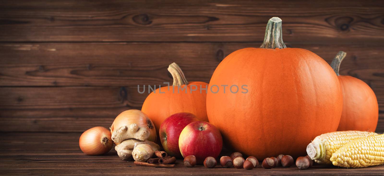 Autumn harvest on wooden table by Yellowj