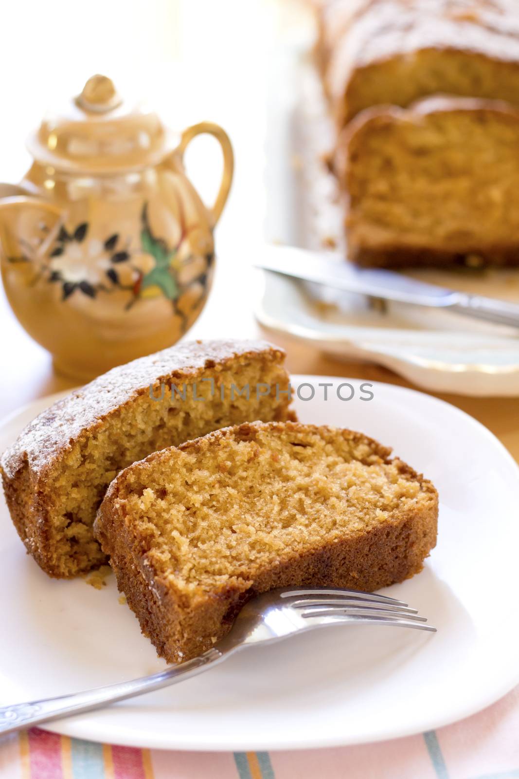 sweet almond homemade cake on white plate with coffee