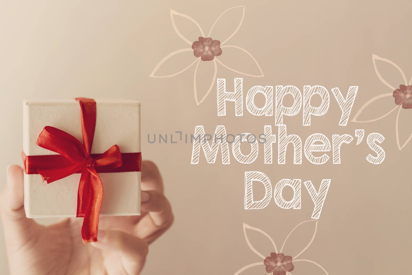 Mother's Day message with white gift box with red ribbon hold on hand woman by sigoisette
