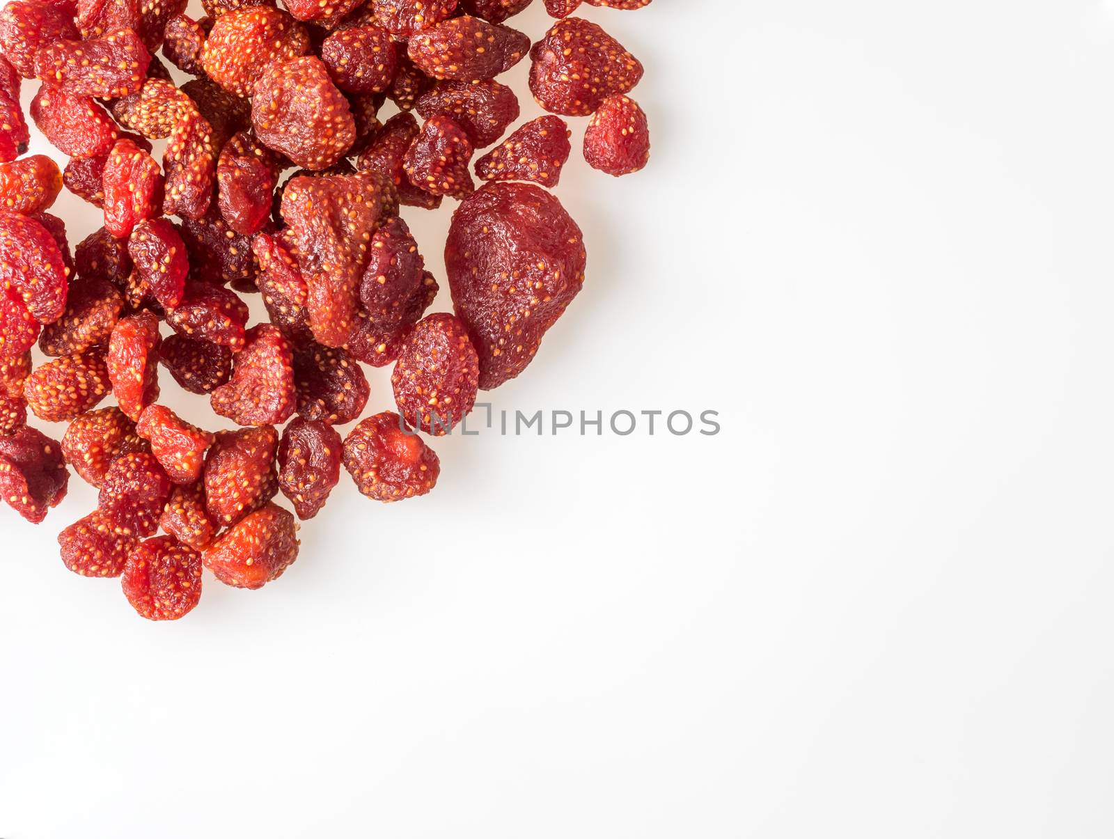 Closeup dried strawberry bake with honey on white background