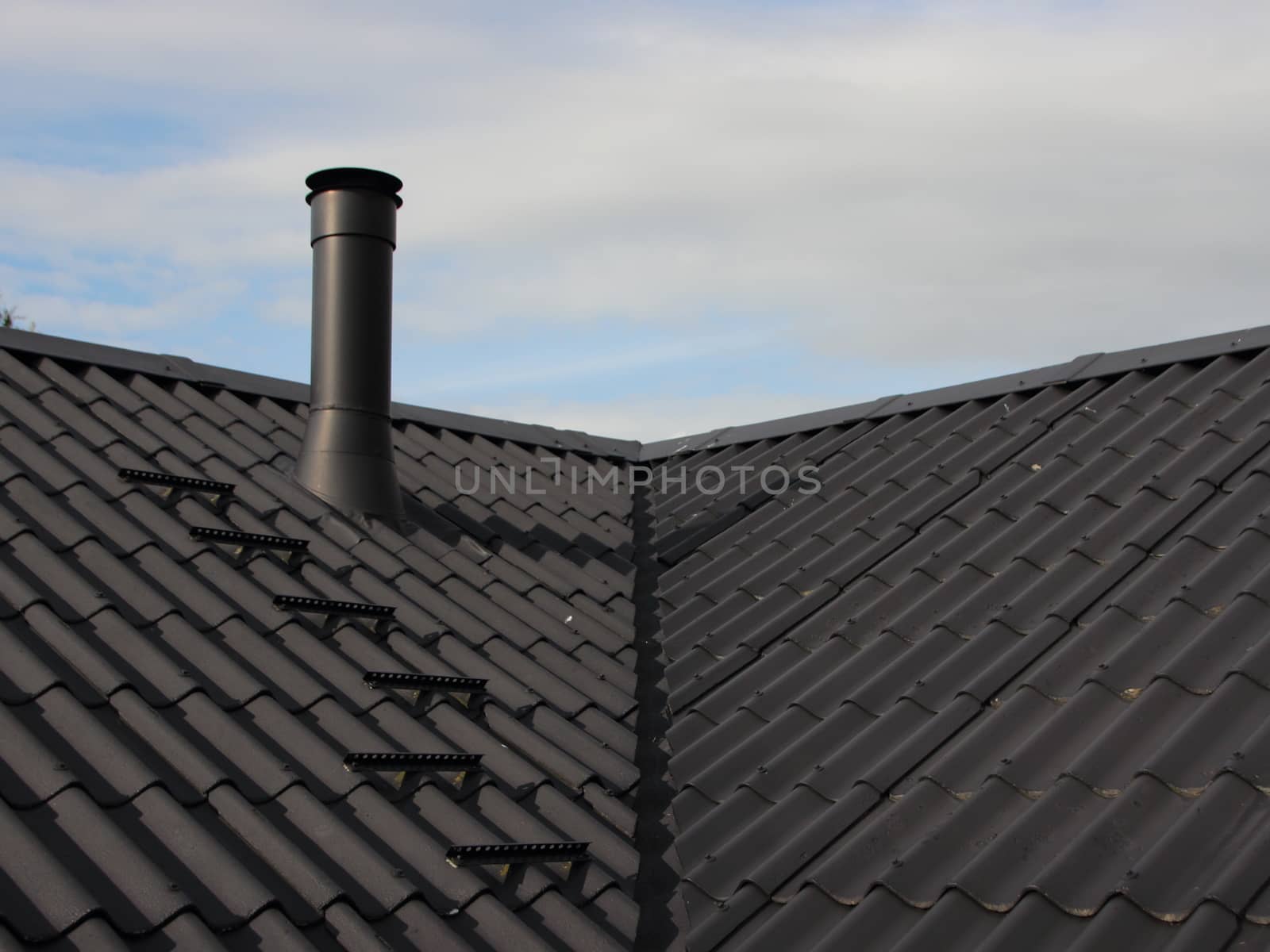 Black Metal Chimney on Roof with Secure Sweeper Steps