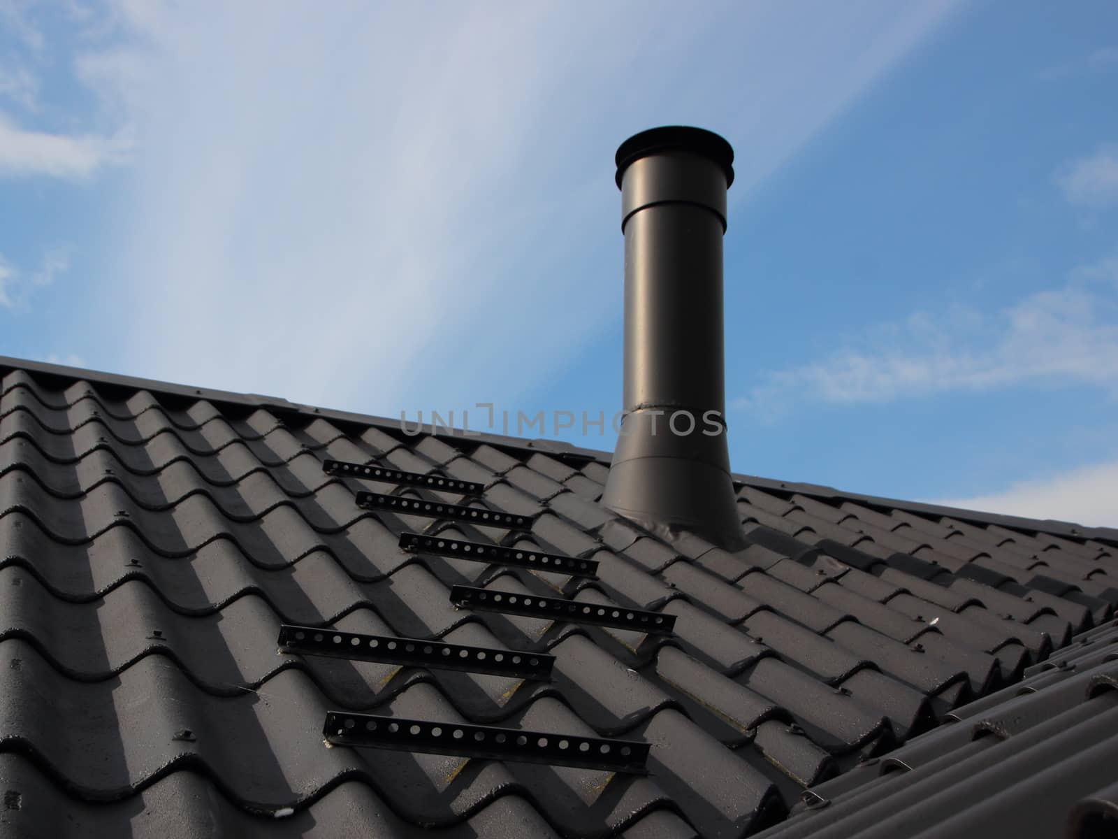Black Metal Chimney on Roof with Secure Sweeper Steps