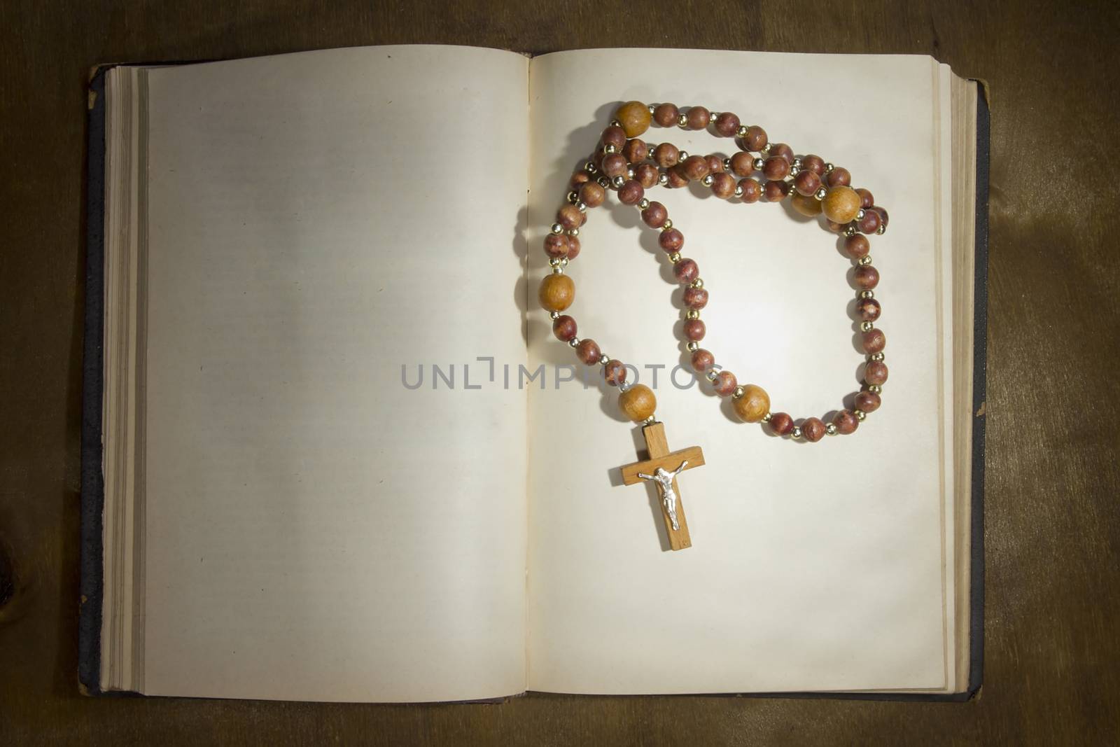 Open book with rosary by VIPDesignUSA