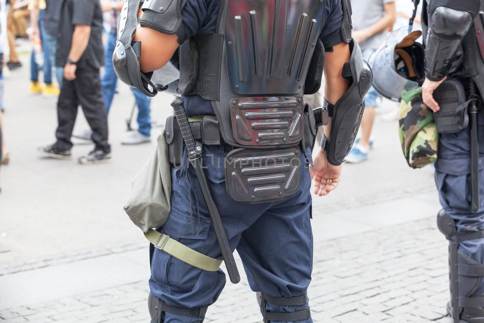 Police officers on duty at a street protest. Law enforcement. by wellphoto