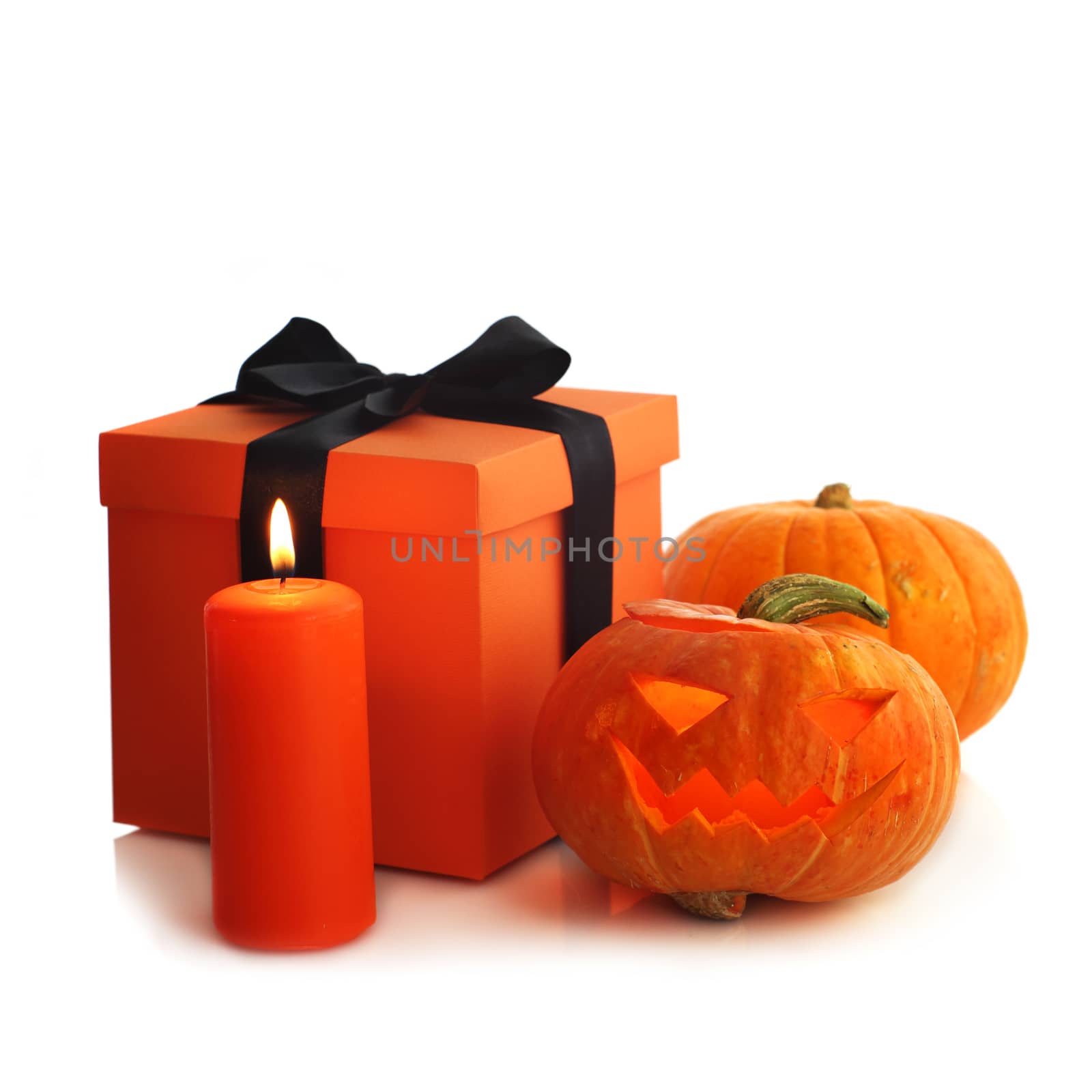 Halloween pumpkin and gifts isolated on white background