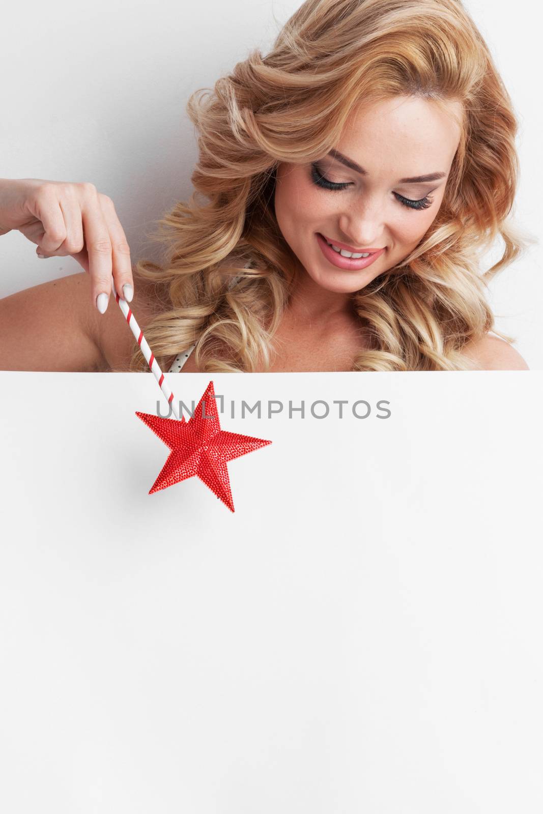 Fairy woman with magic wand with star pointing at white background