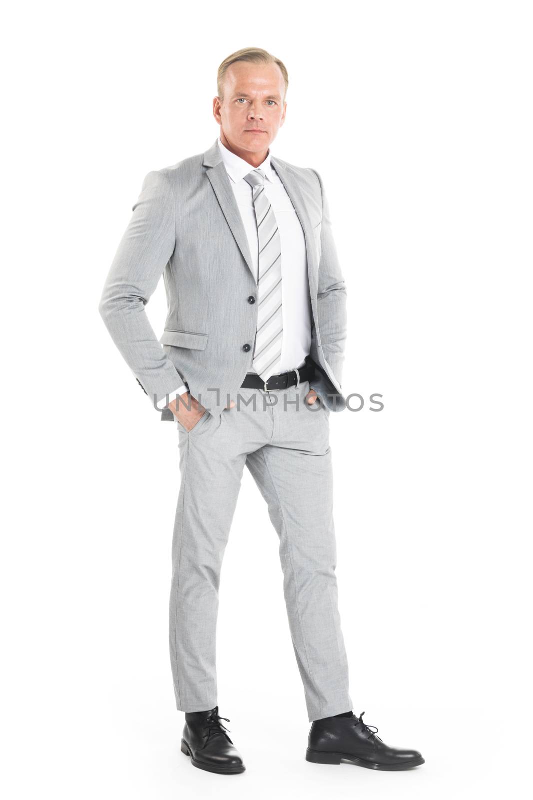 Portrait of mature business man in gray suit isolated on white background