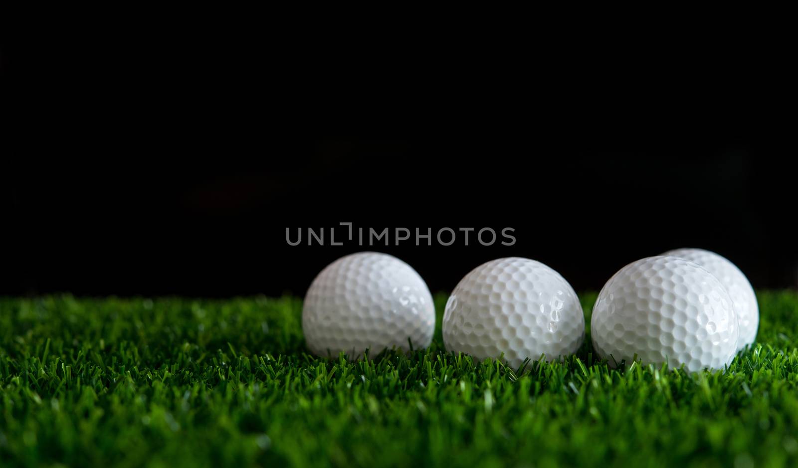 golf ball on green grass by antpkr