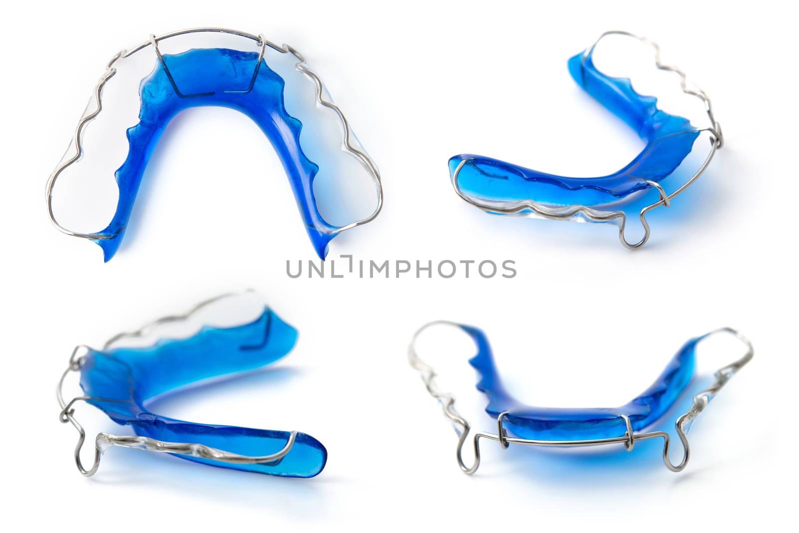 collection of retainer orthodontic equipment on white background