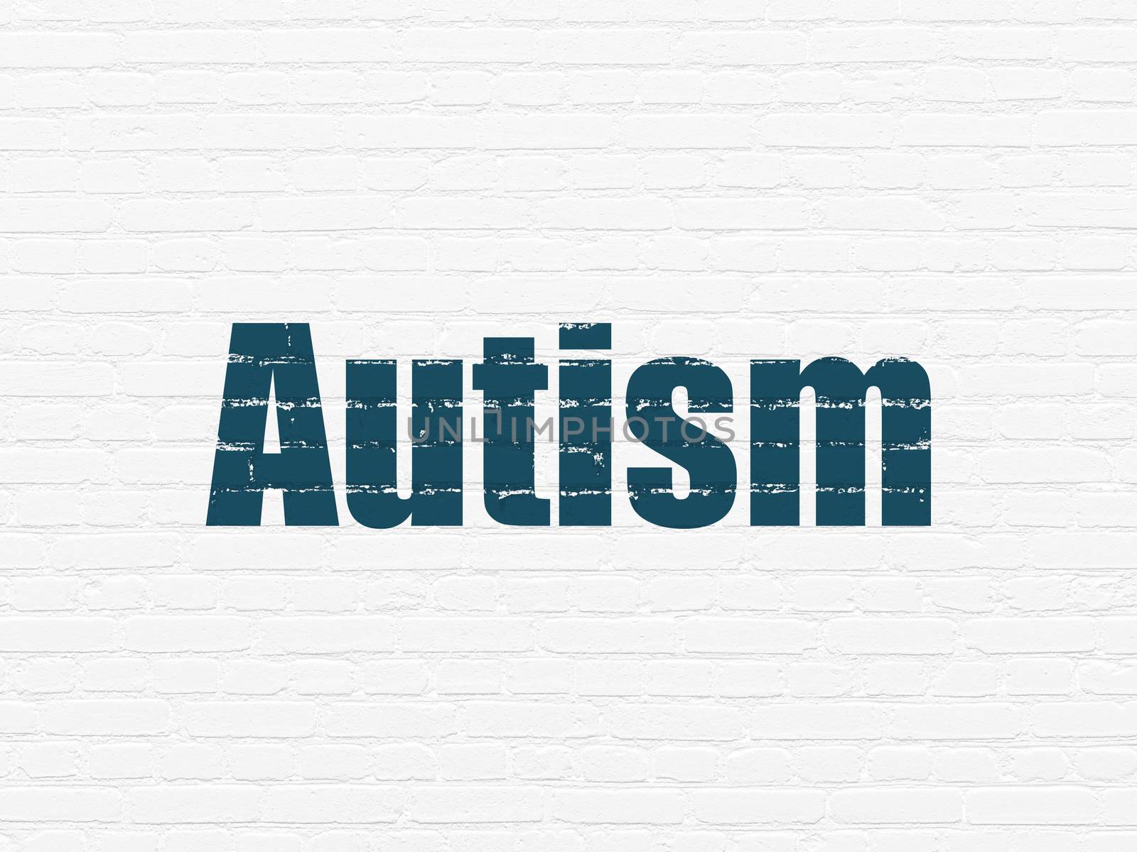 Health concept: Painted blue text Autism on White Brick wall background