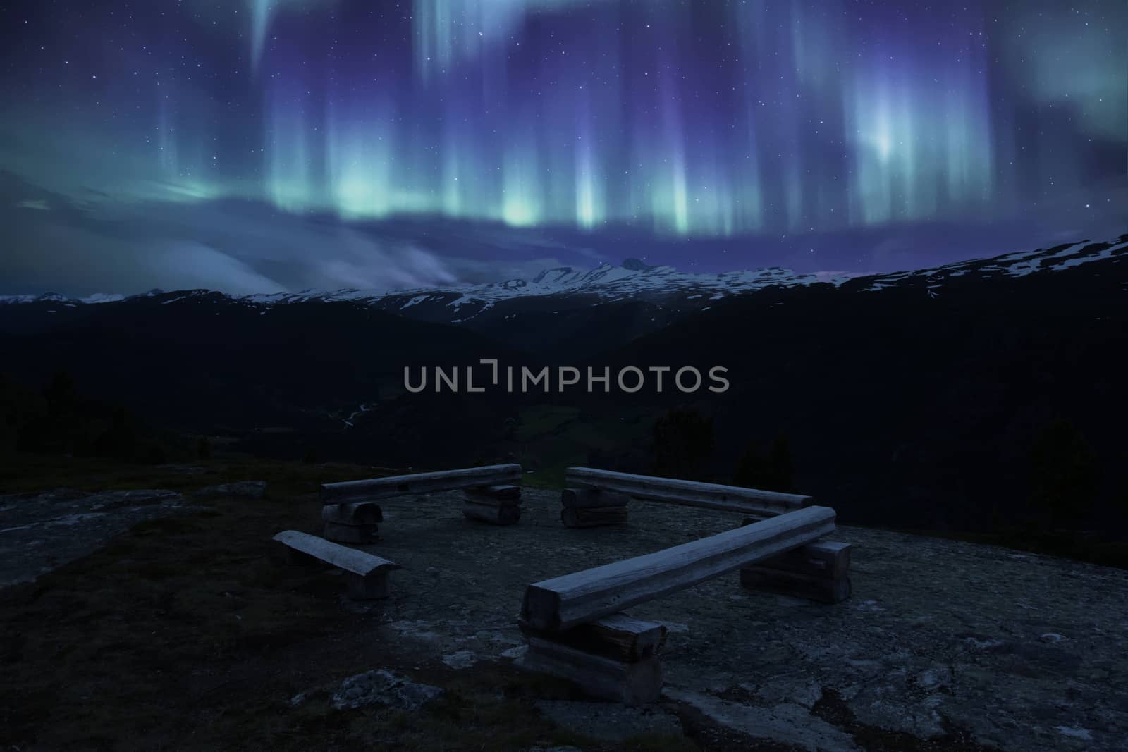 A bench in Norwegian mountains jotunheimen with aurora by eswaran