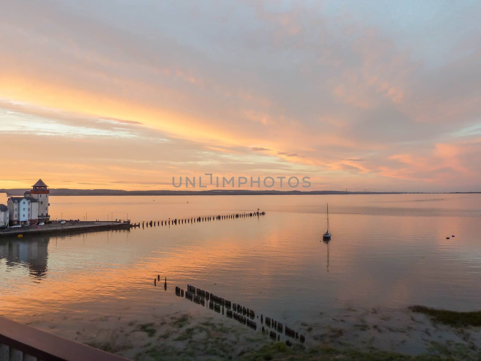 sunset over the estuary with jetty