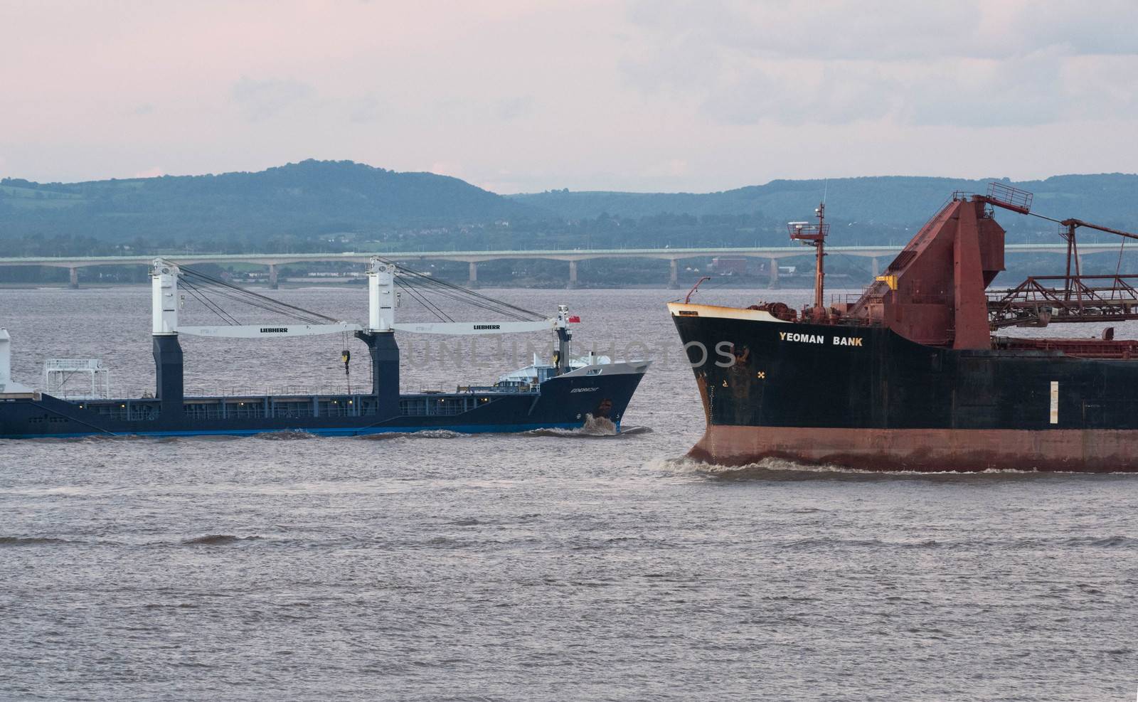 two freight ships come close passing in the Bristol channel