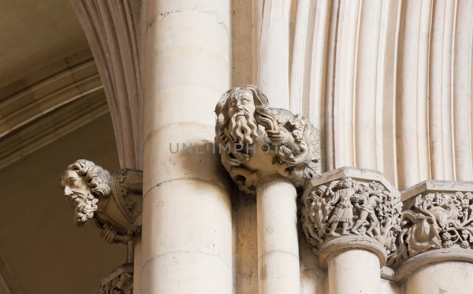 carved stone statue heads in a church