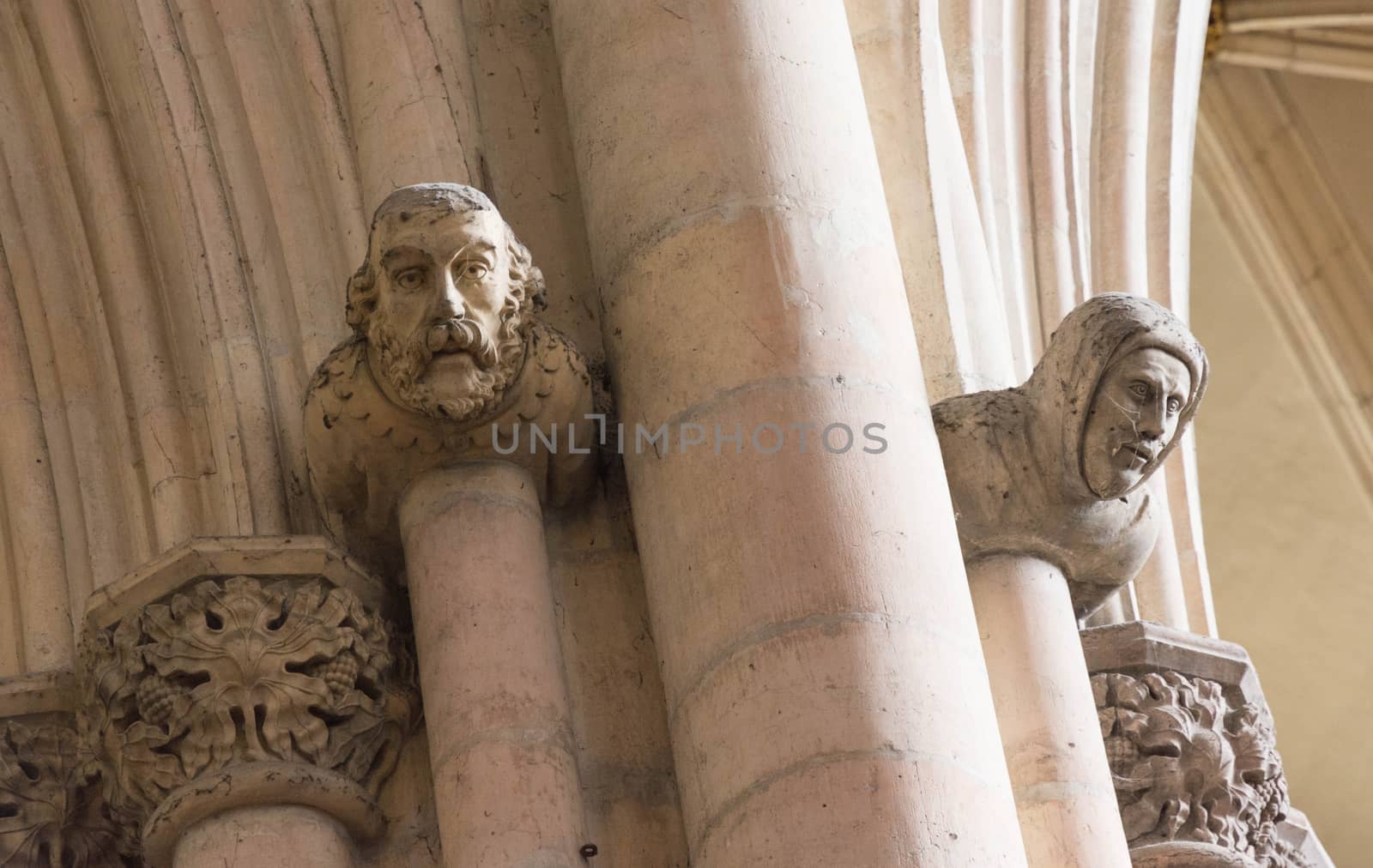 carved stone heads in a church