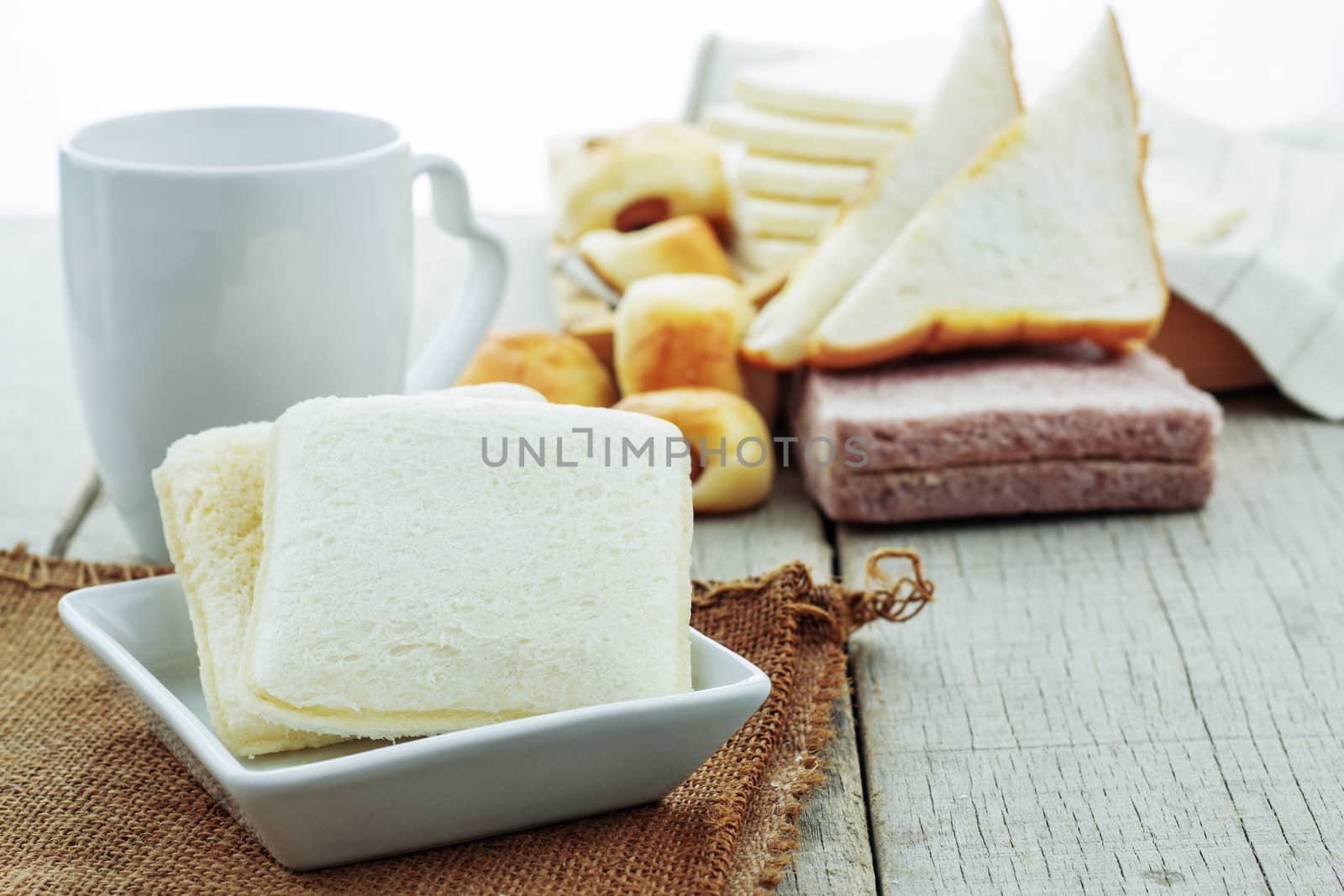 bread and coffee on table. by start08