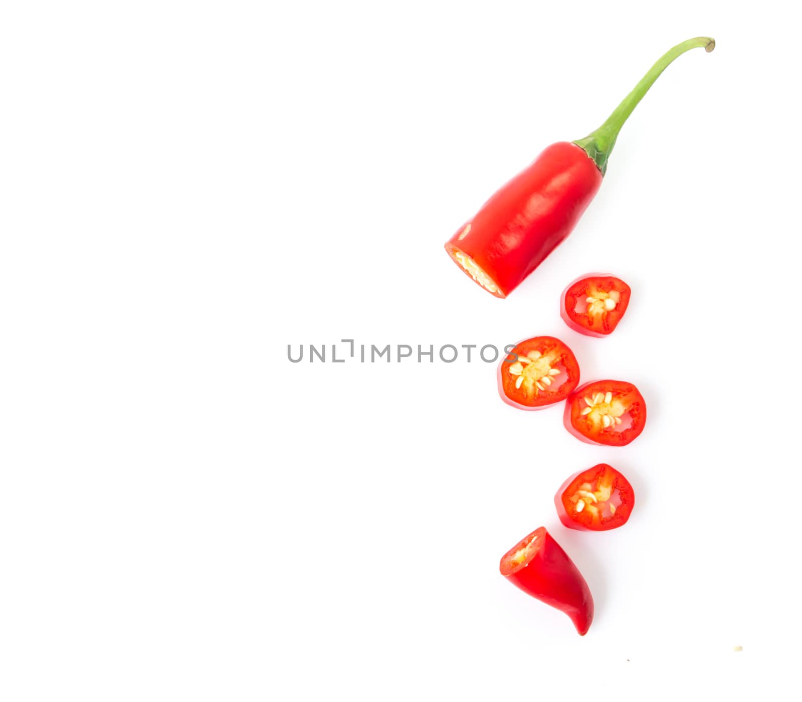 Closeup top view red chili pepper with sliced on white background, raw food ingredient concept