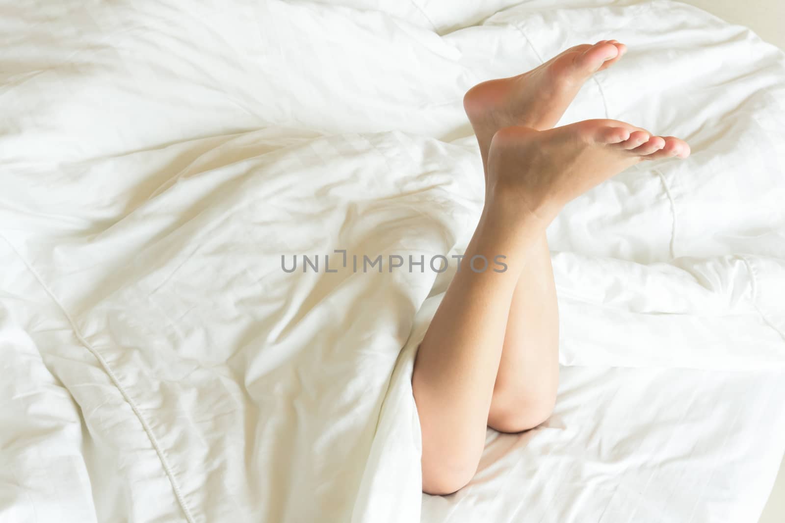 Woman legs relax on the bed after waking in the morning, selecti by pt.pongsak@gmail.com