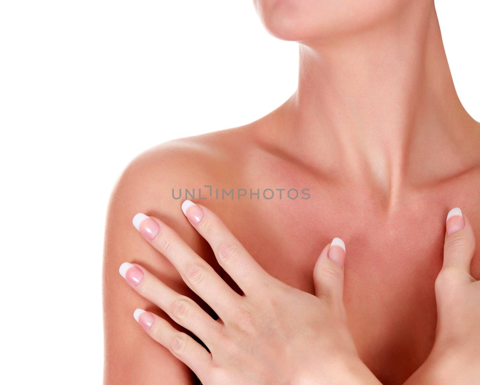 Closeup shot of beautiful woman with soft and clean skin, hands with french manicured nails. Isolated on white background