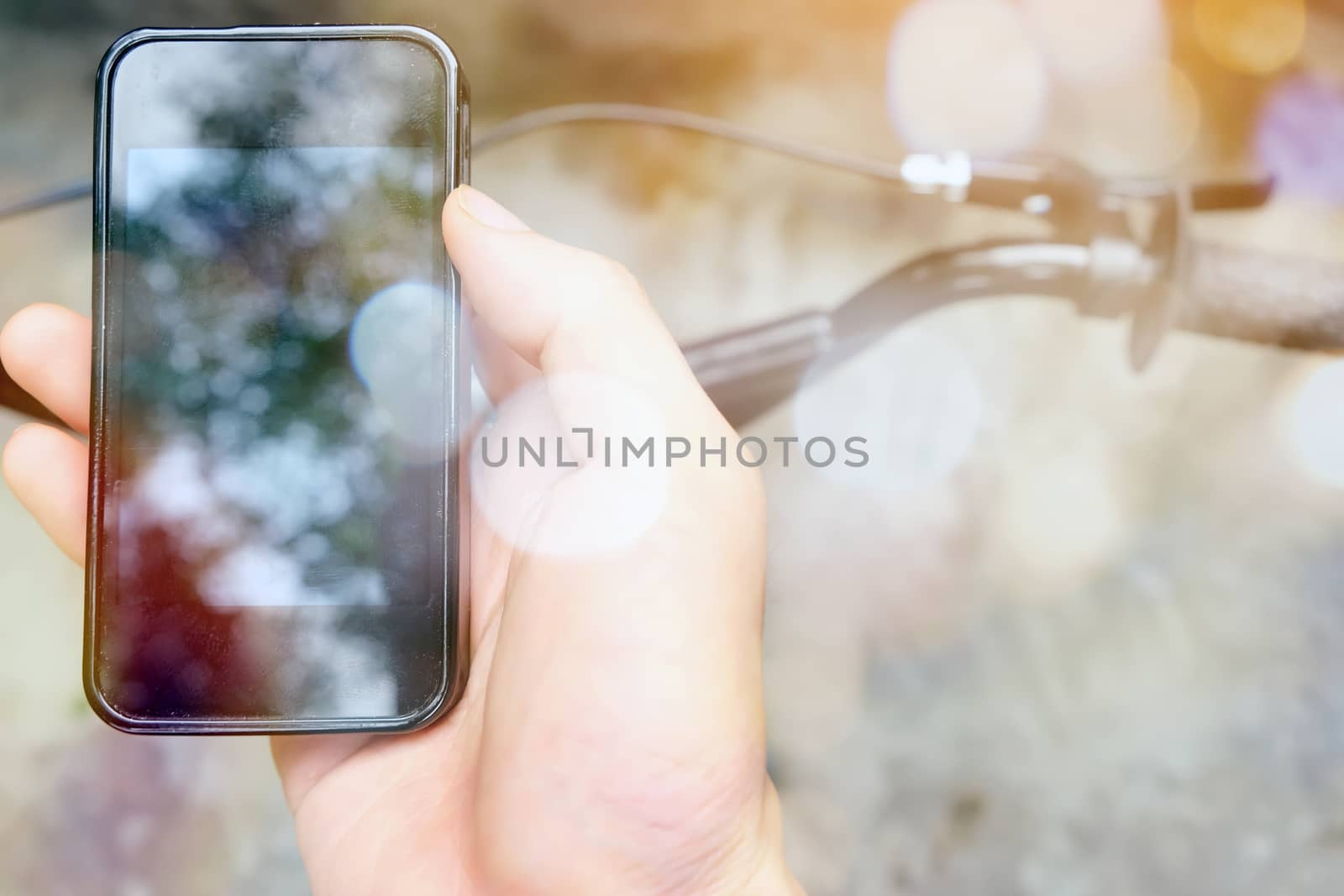 image of a biker texting on a smart phone