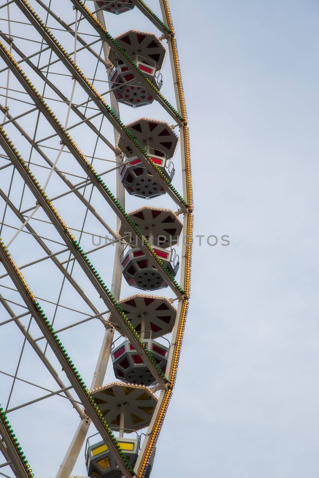 Ferris wheel in front of a blue sky